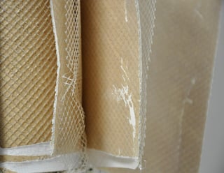 Fouled reverse osmosis membrane leaf with sediment on its surface
