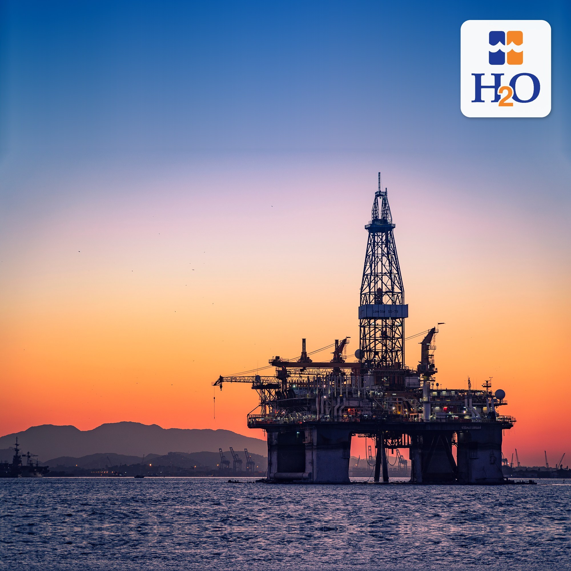 Offshore oil and gas platform at sunset